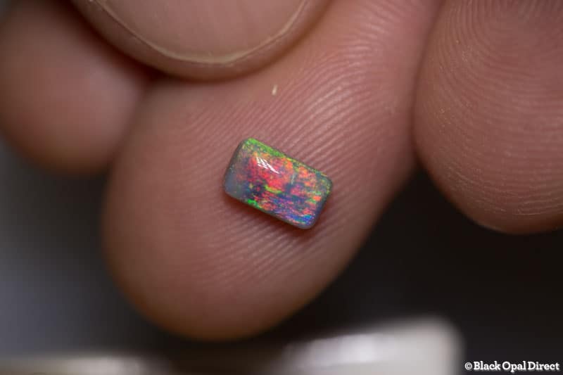 0.71 ct semi black opal cushion 7x4x3mm - Image 2
