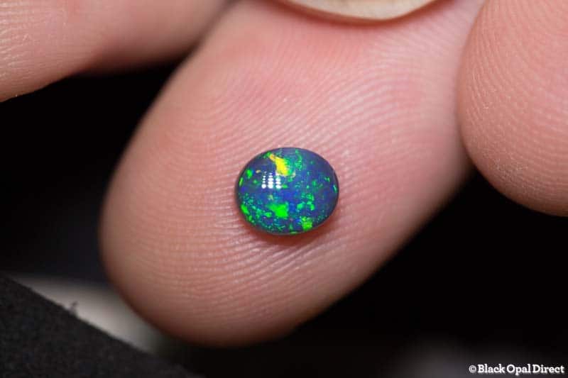 0.72 ct black opal 6.5x5.5x3mm - Image 2