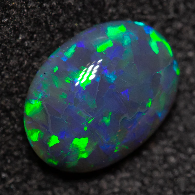 0.72 ct black opal 7.3x5.4x2.8mm - Image 2
