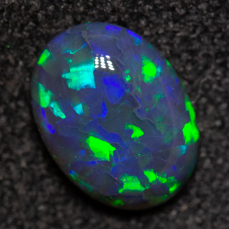0.72 ct black opal 7.3x5.4x2.8mm - Image 3