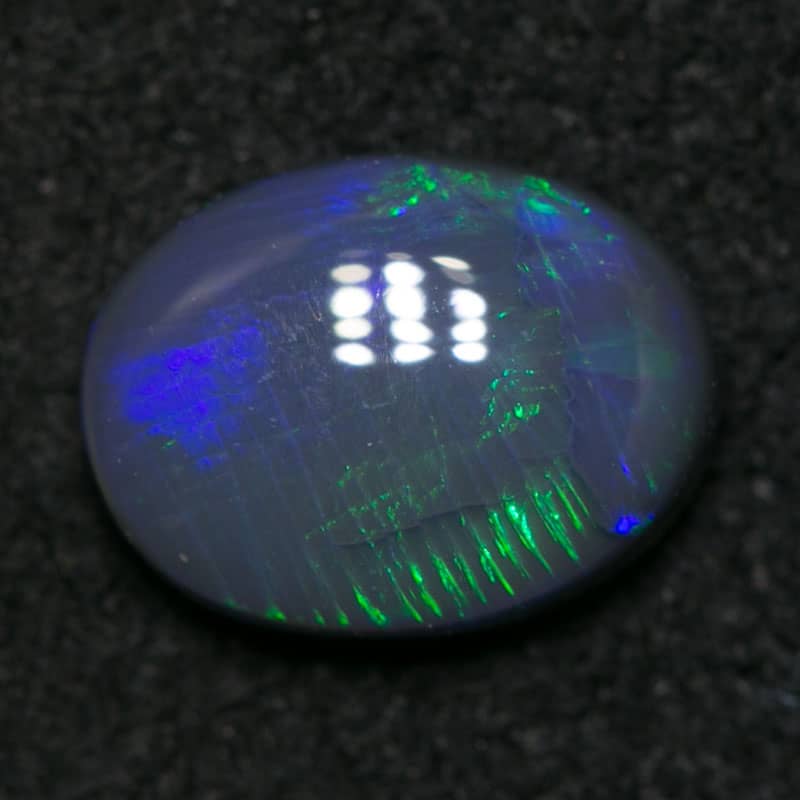 0.72 ct black opal 7x5.5x2mm - Image 3