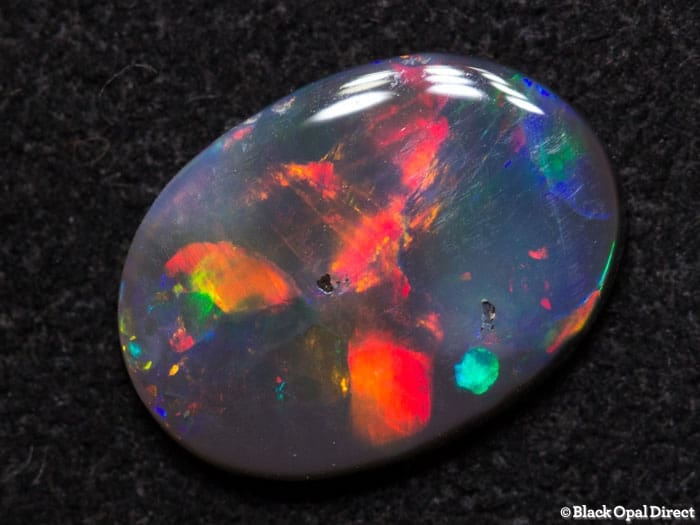 0.72 ct black opal 9.5x7x1.5mm - Image 2