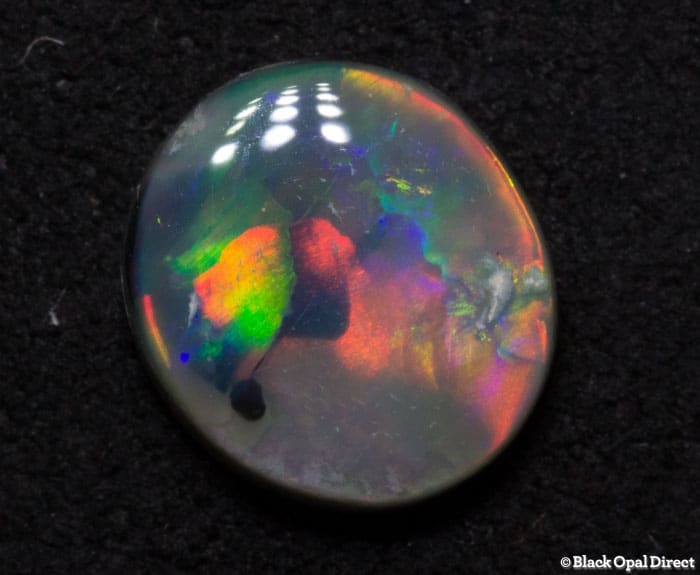 0.72 ct semi black opal 7x6.5x2mm - Image 2