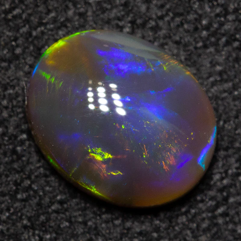 0.73 ct black opal 7.2x5.8x2.7mm - Image 3