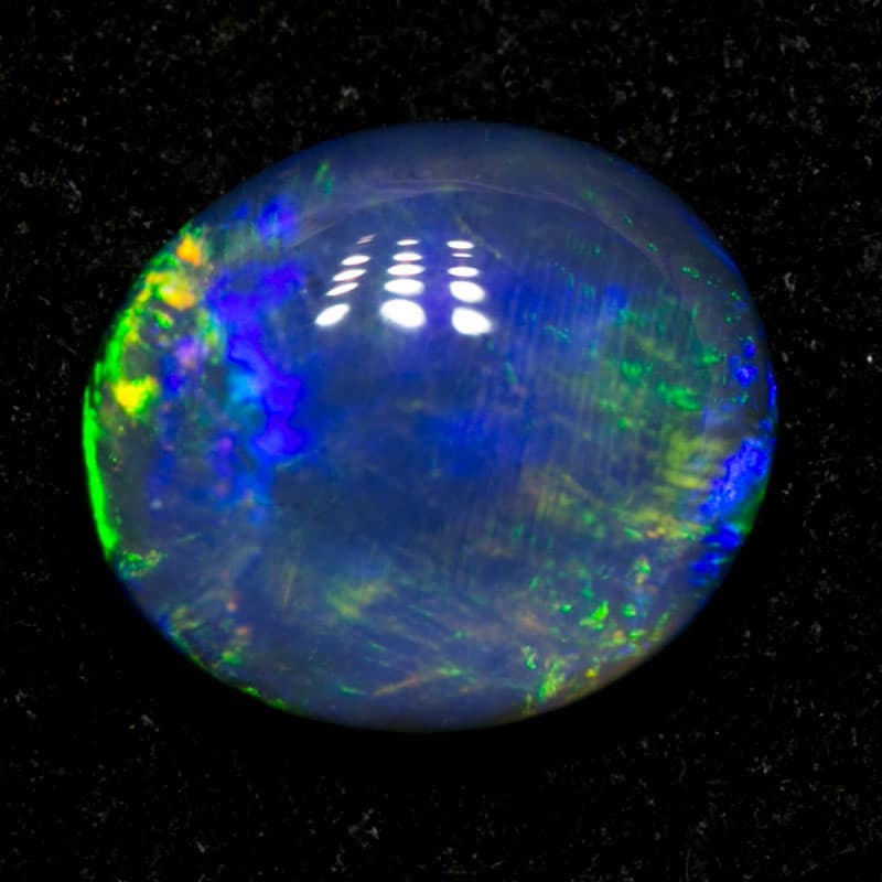 0.73 ct black opal 7x6x2mm - Image 2