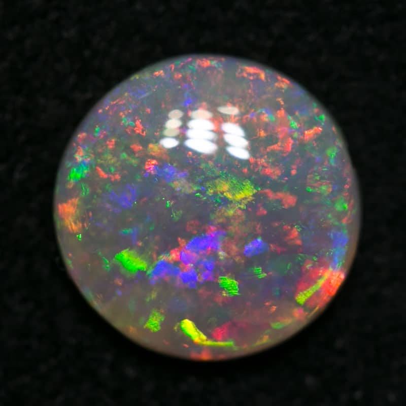 0.74 ct crystal opal 7mm round x 2mm - Image 2