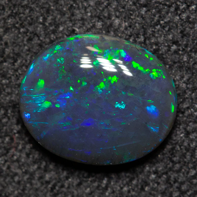 0.75 ct black opal 7.4x6x2.4mm - Image 2