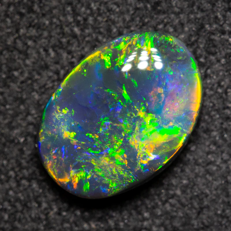 0.75 ct black opal 7.6x5.5x2.7mm - Image 2