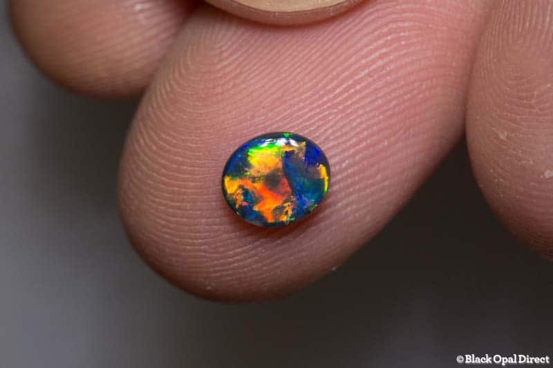 0.75 ct top gem black opal 7x6x2mm - Image 4