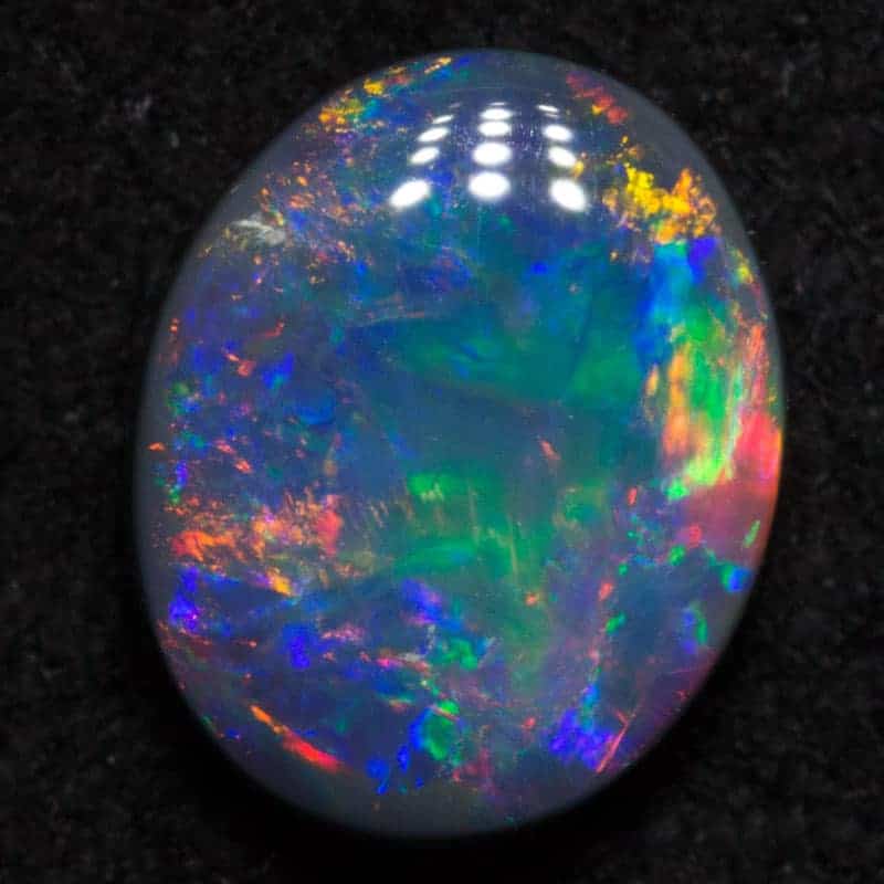 0.76 ct black opal 7x5.6x2.5mm - Image 2