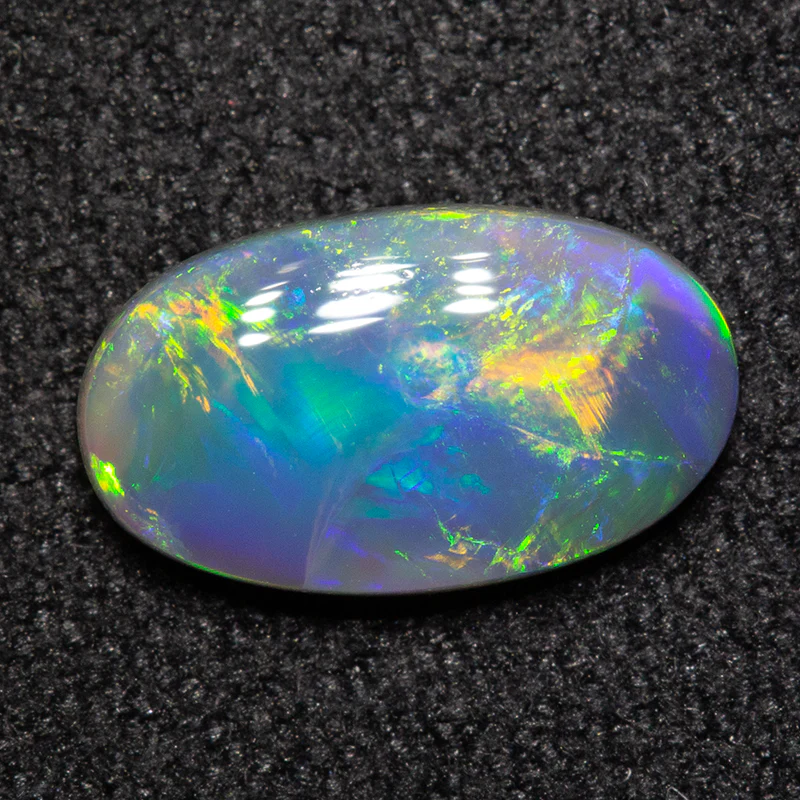 0.76 ct black opal 9.2x5.4x2.3mm - Image 2