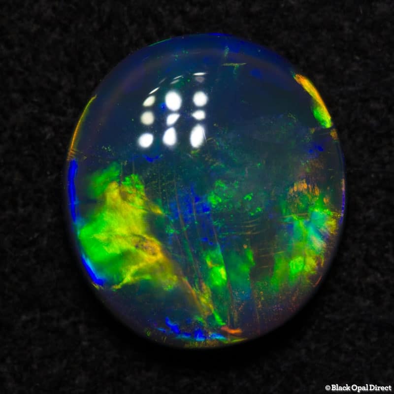 0.77 ct black opal gem 7x6.5x2mm - Image 2
