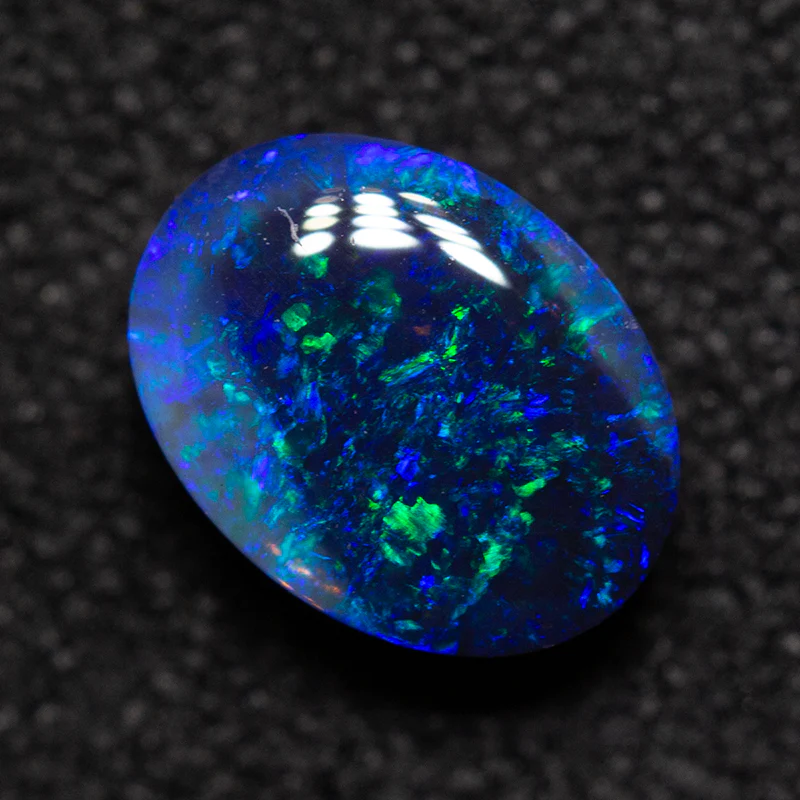 0.78 ct black opal 7.1x5.3x3.4mm - Image 2