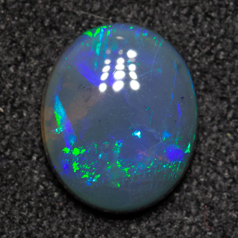 0.78 ct black opal 7.9x6.5x2.3mm - Image 2
