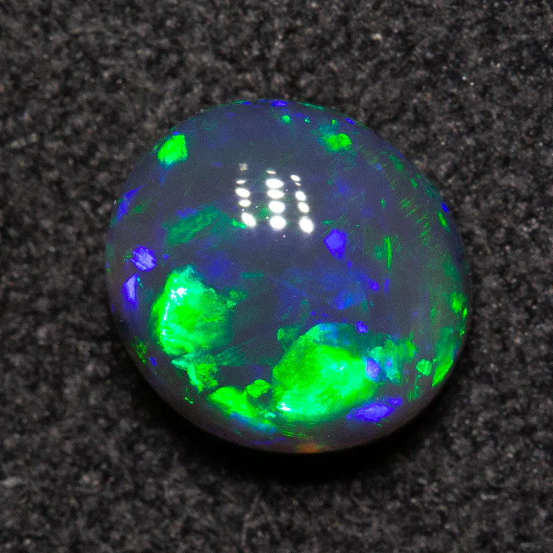 0.79 ct black opal 6.2x5.7x3.4mm - Image 3