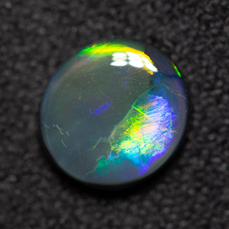 0.79 ct black opal 6.9x6.4x2.5mm - Image 2