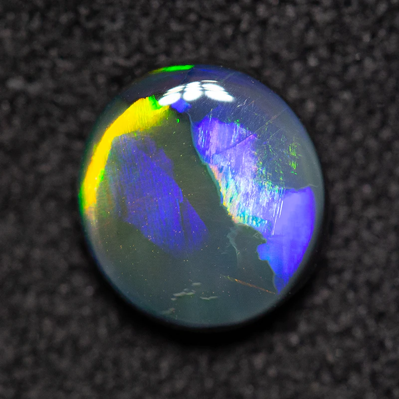 0.79 ct black opal 6.9x6.4x2.5mm - Image 4