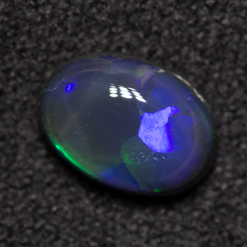 0.79 ct black opal 7x5.5x3mm - Image 2