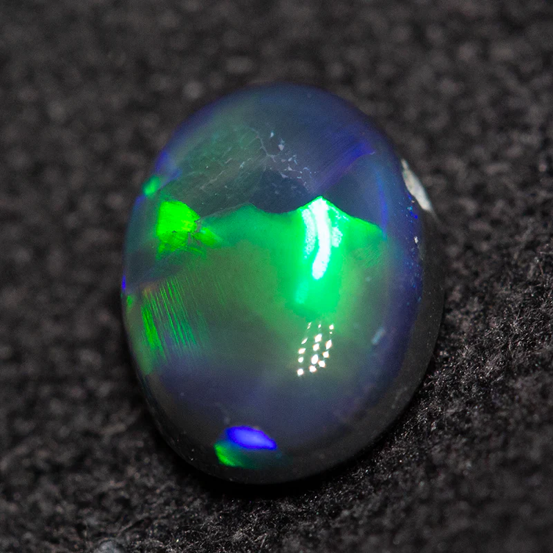 0.79 ct black opal 7x5.5x3mm - Image 4