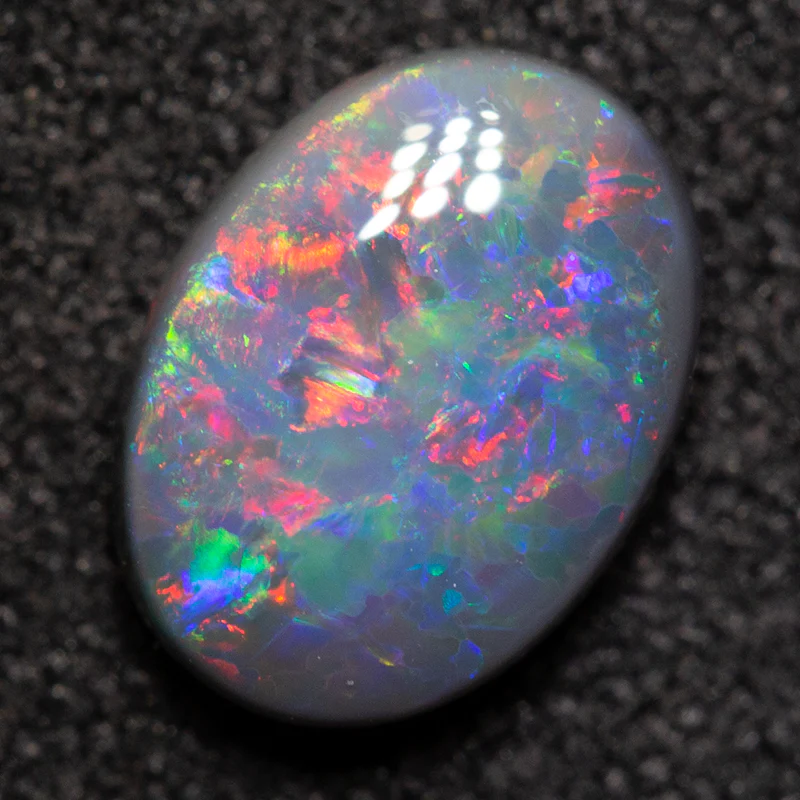 0.80 ct black opal 7.7x5.7x2.7mm - Image 2