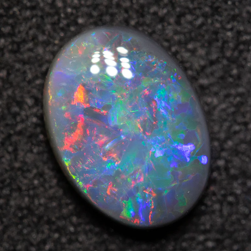 0.80 ct black opal 7.7x5.7x2.7mm - Image 4
