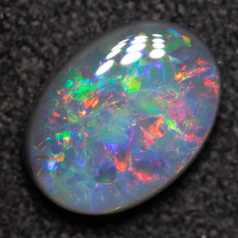 0.80 ct black opal 7.7x5.7x2.7mm - Image 5