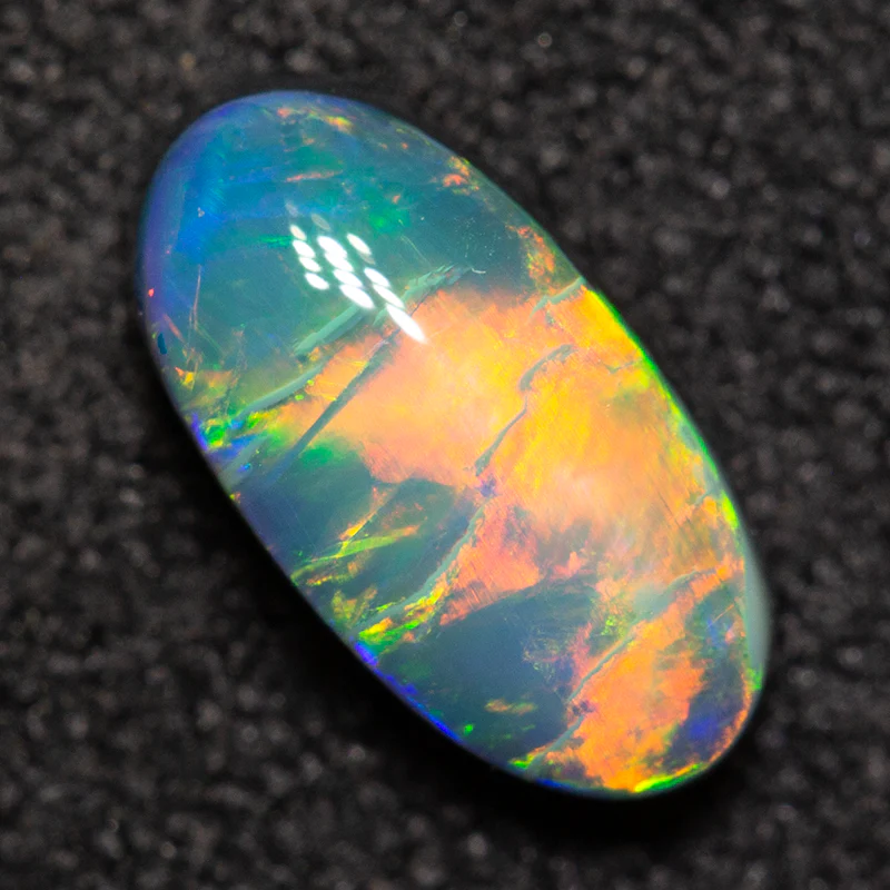 0.81 ct black opal 8.5x4.4x3mm - Image 2