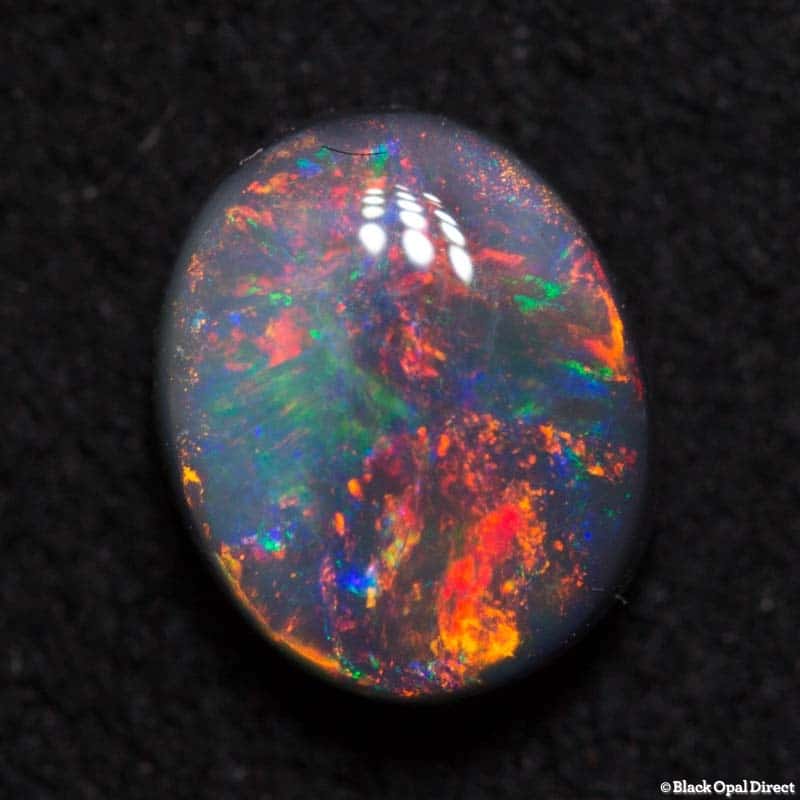 0.81 ct black opal gem 6.5x5x3mm - Image 2