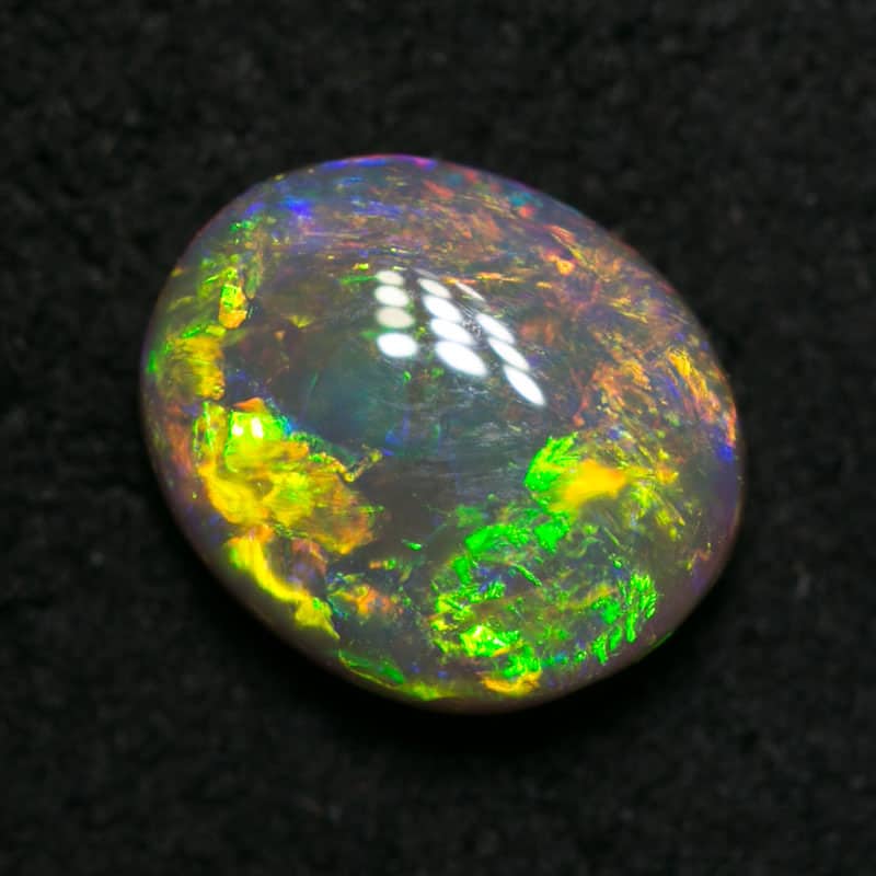 0.81 ct dark opal 7x6x3mm - Image 4