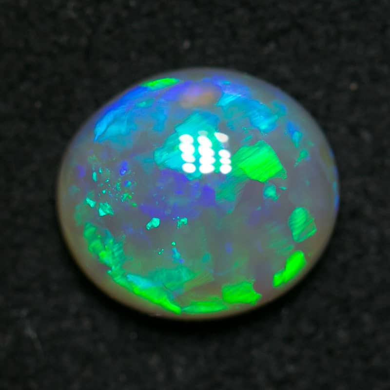 0.81 ct green crystal opal 7x6x3mm - Image 2