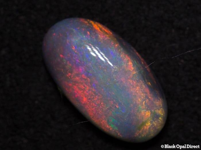0.81 ct semi black opal 9x5x3mm - Image 2