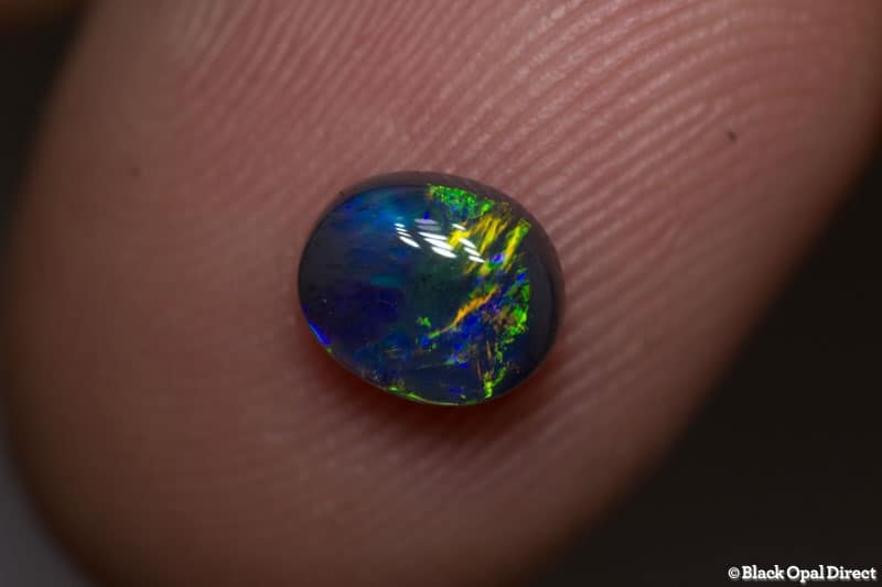 0.82 ct black opal 6.5x6x3mm - Image 2