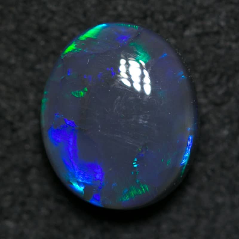 0.83 ct black opal 7x6x3mm - Image 3