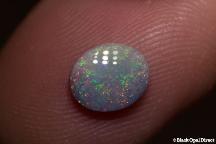 0.83 ct semi black opal 8x7x2.5mm - Image 2
