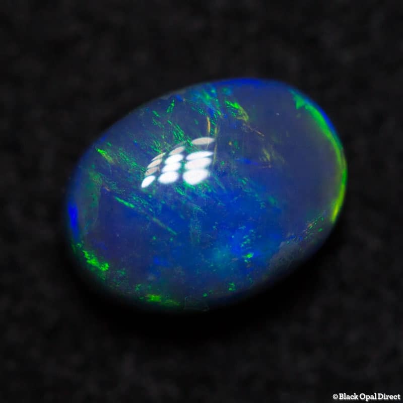 0.84 ct black opal 6.3x4.9x4mm - Image 2