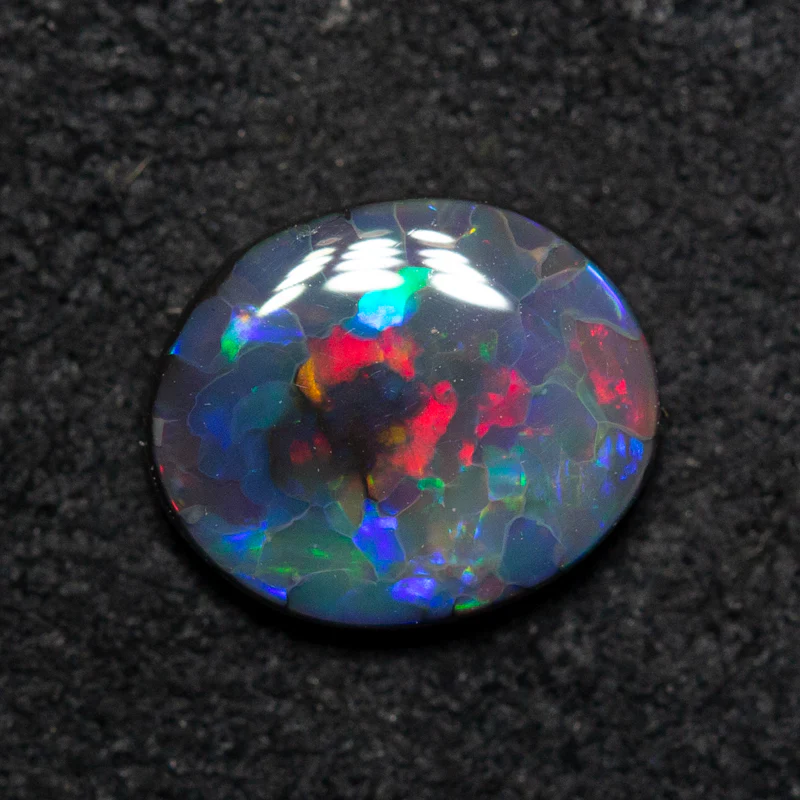 0.84 ct black opal 7.9x6.6x2.5mm - Image 2