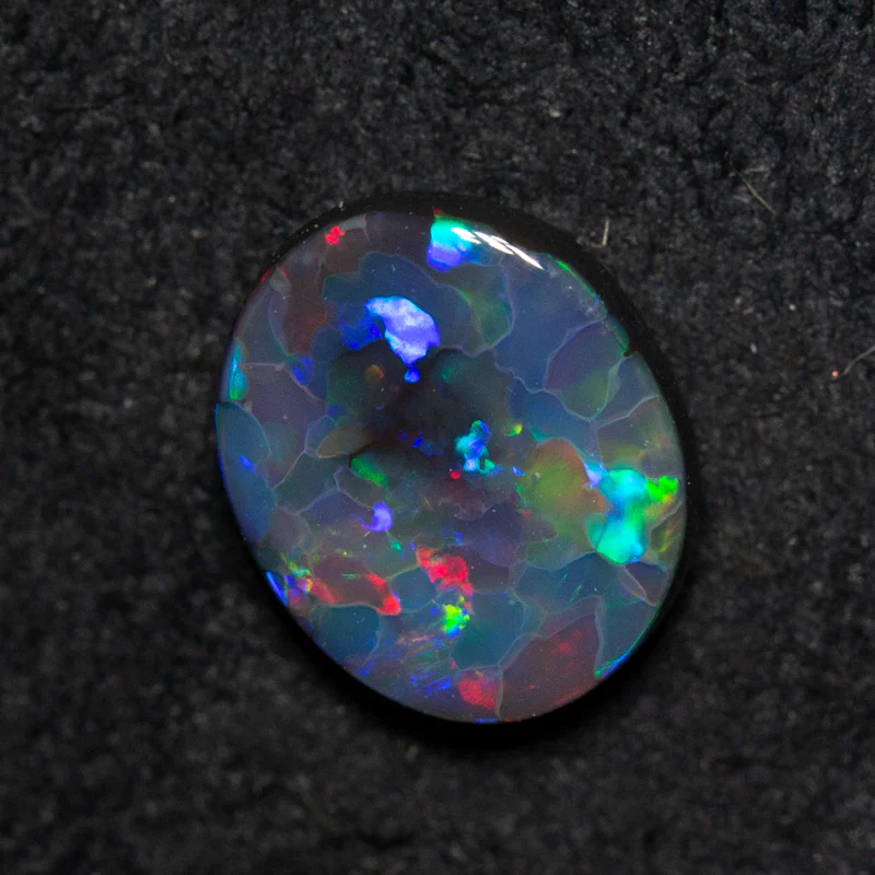 0.84 ct black opal 7.9x6.6x2.5mm - Image 3