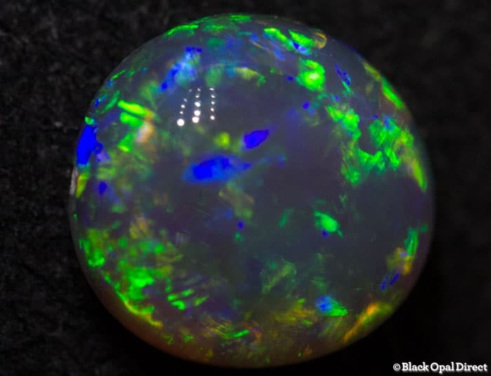 0.84 ct gem green dark crystal opal 7x6x3.5mm - Image 2