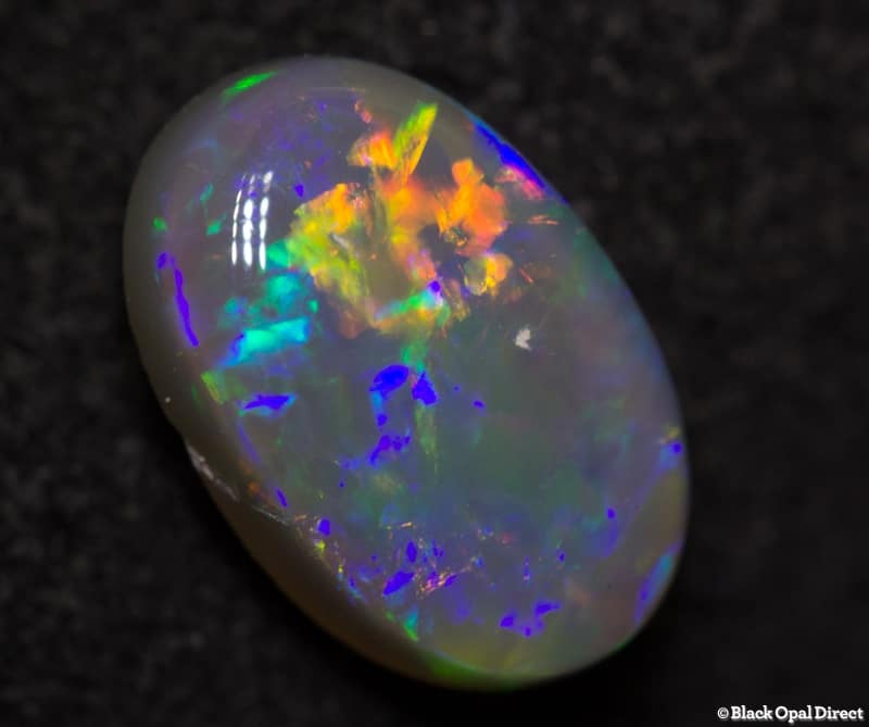 0.84 ct semi black opal 8x5x3mm - Image 4