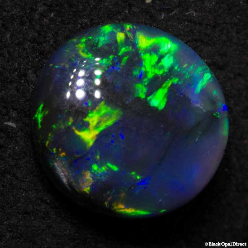 0.85 ct black opal 6mm round x3mm - Image 2