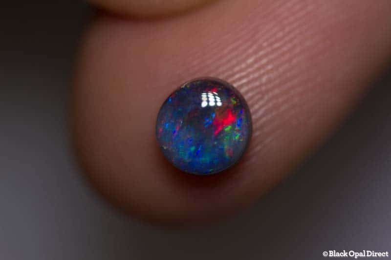 0.85 ct black opal 6mm round x3mm thick - Image 2