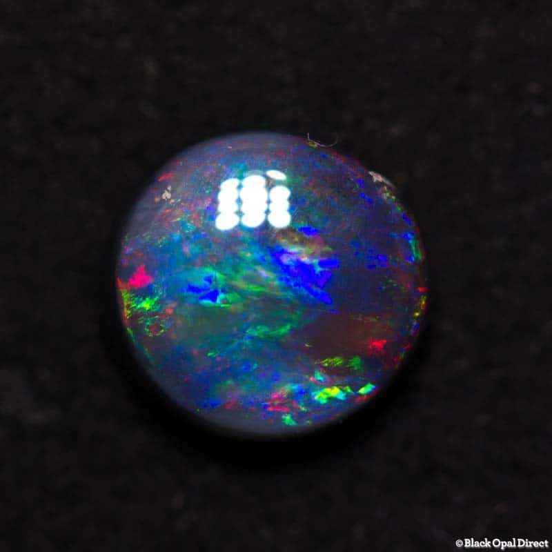 0.85 ct black opal 6mm round x3mm thick - Image 3