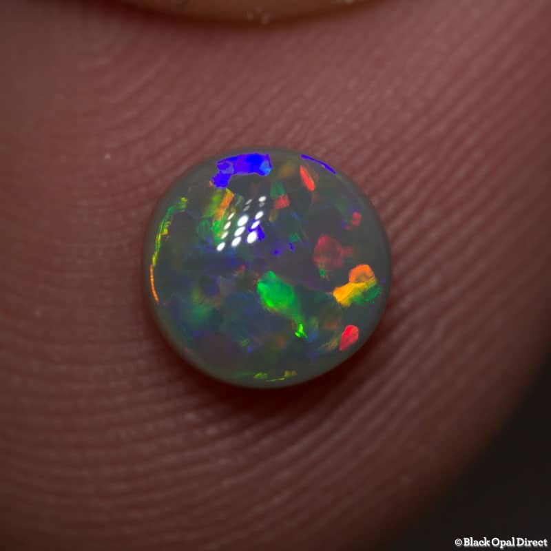 0.85 ct semi black opal 7mm round x 3mm - Image 2