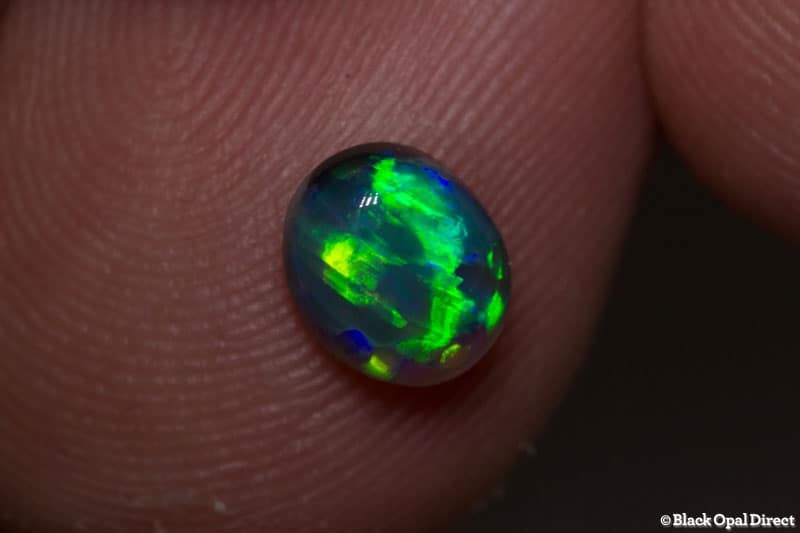 0.86 ct black opal gem 7x6x4mm - Image 2