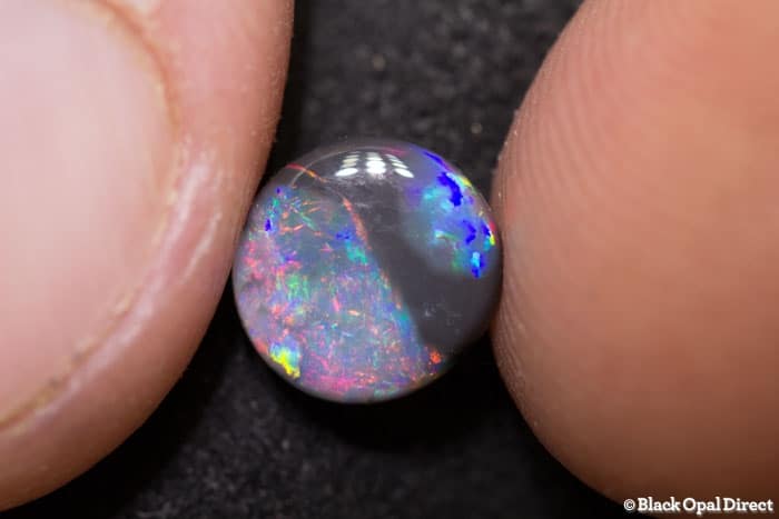 0.86 ct parti colored opal 8x7x2mm - Image 3