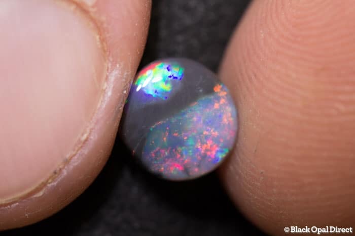0.86 ct parti colored opal 8x7x2mm - Image 4