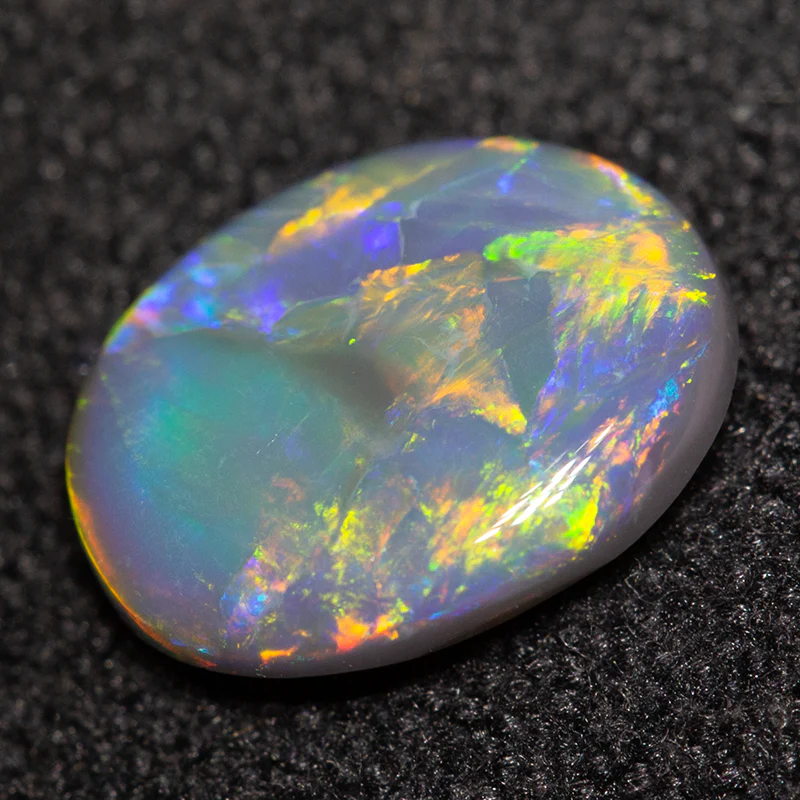 0.87 ct black opal 8.4x6.5x2.4mm - Image 2