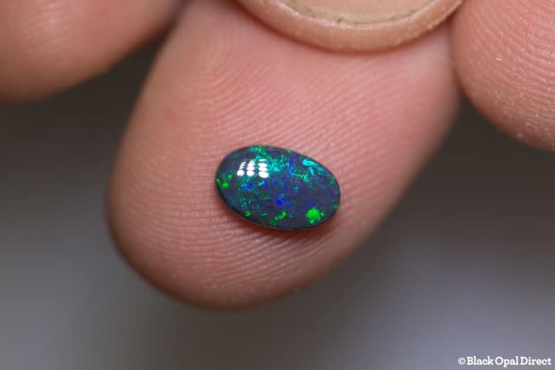 0.87 ct black opal 8.5x5x3mm - Image 2