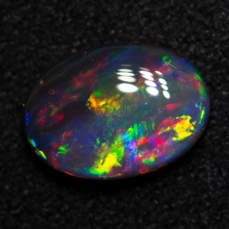 0.89 ct black opal 8x5.8x2.8mm - Image 2