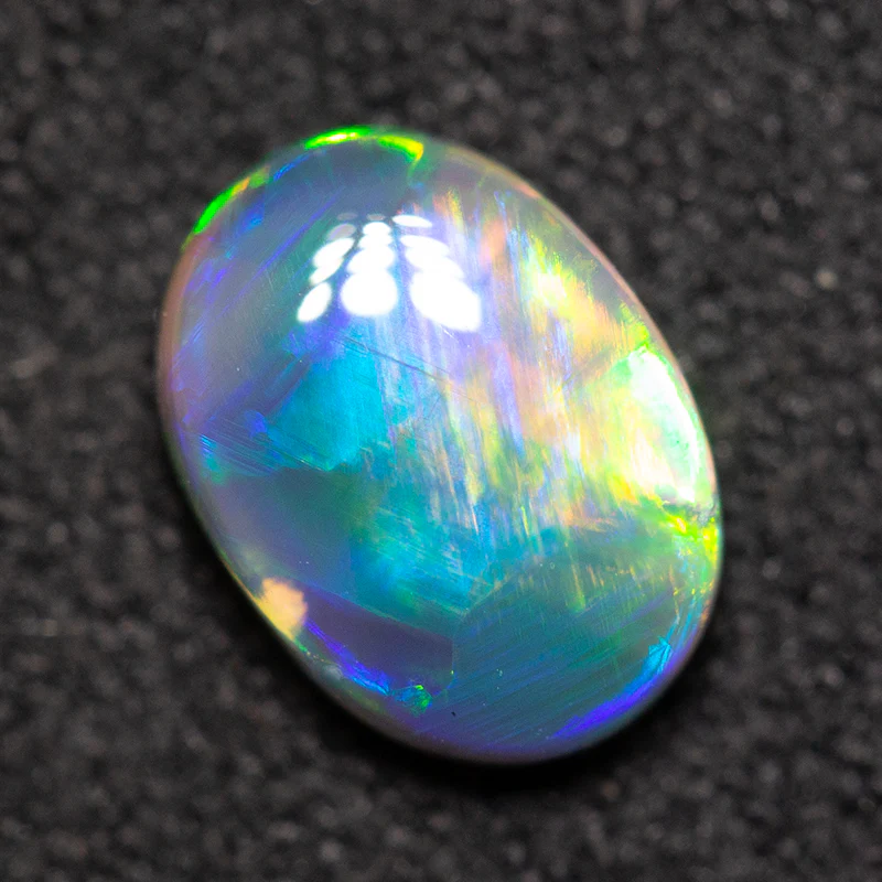 0.90 ct black opal 7.9x5.8x3.2mm - Image 4